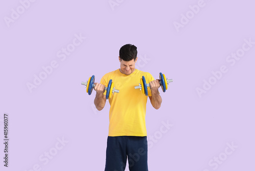 Man in yellow shirt doing d...