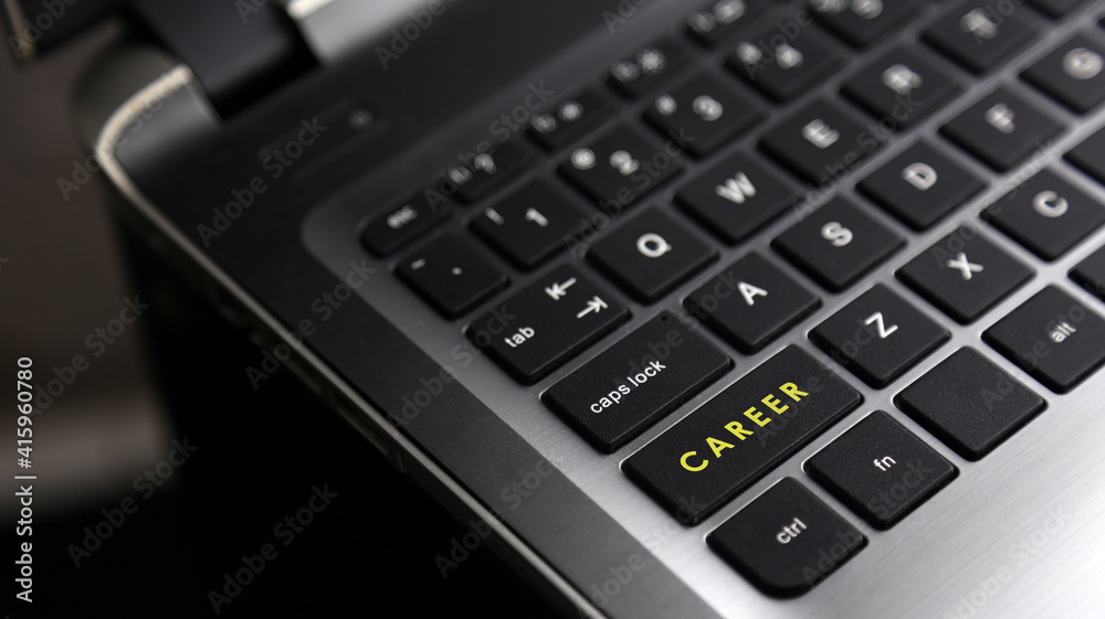 Laptop keyboard button with CAREER word. Concept for human resources and business. Laptop keyboard button with CAREER word. Concept for human resources and business.