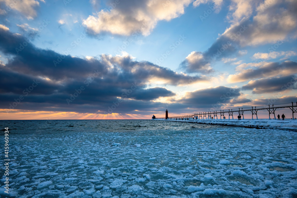Fototapeta premium sunset over the pier, Grand Haven Lighthouse 