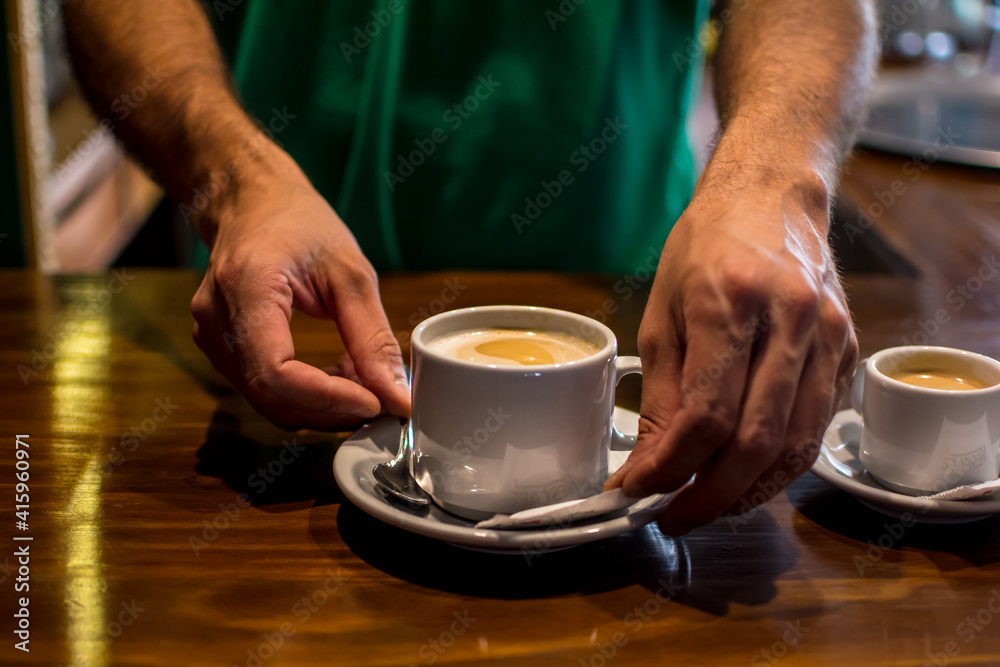 man holding cup of coffee man holding cup of coffee