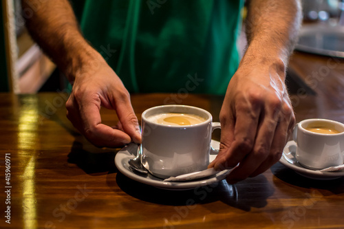 man holding cup of coffee