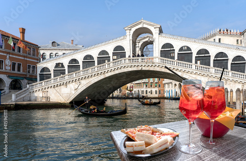 Spritz for two with sandwiches and snacks overlooking the Rialto Bridge in Venice © cesaresent