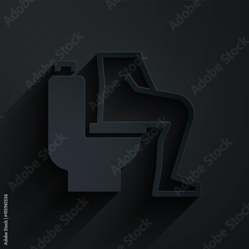 Paper cut Men sitting on the toilet and Constipation are experiencing severe abdominal pain icon isolated on black background. Paper art style. Vector.