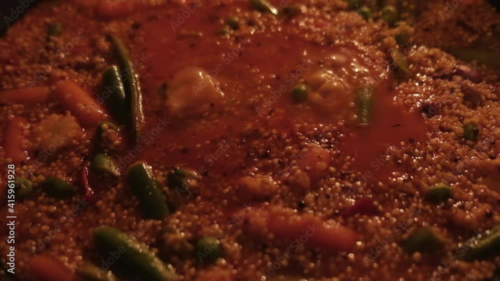Seething boiling delicious with tomato quinoa paste with vegetables. A bubbling vegetarian dish of Peas, Beans, Corn, Peas, Quinoa. A terrible, scary soup.