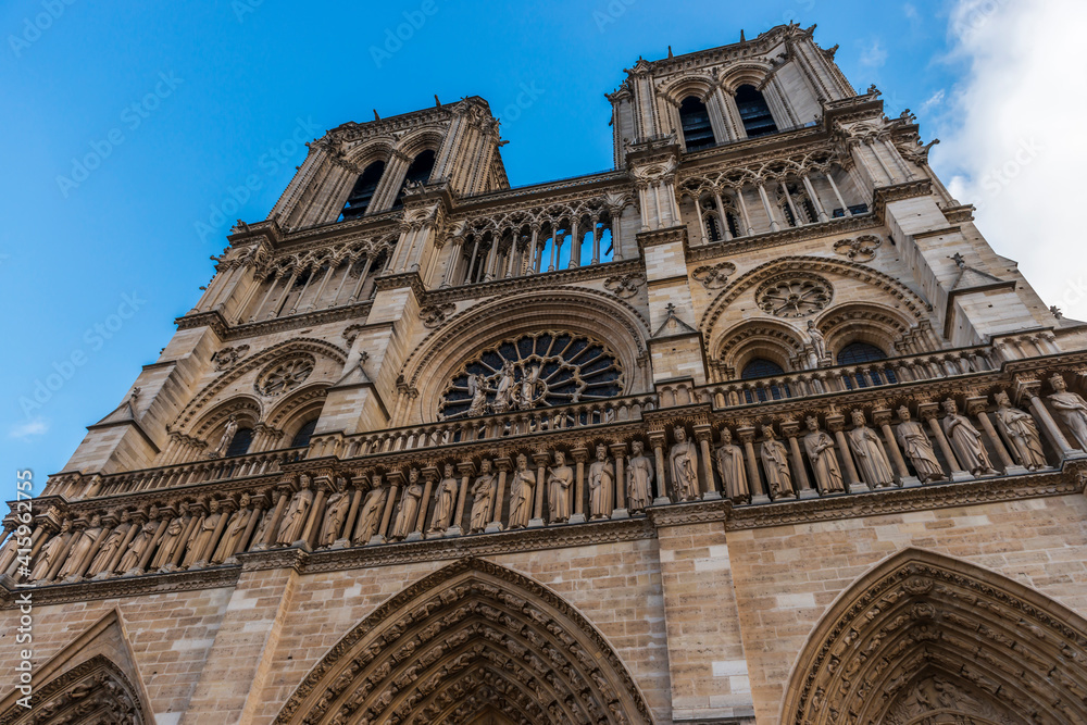 Facade of the magnificent Notre Dame cathedral, in Paris, France