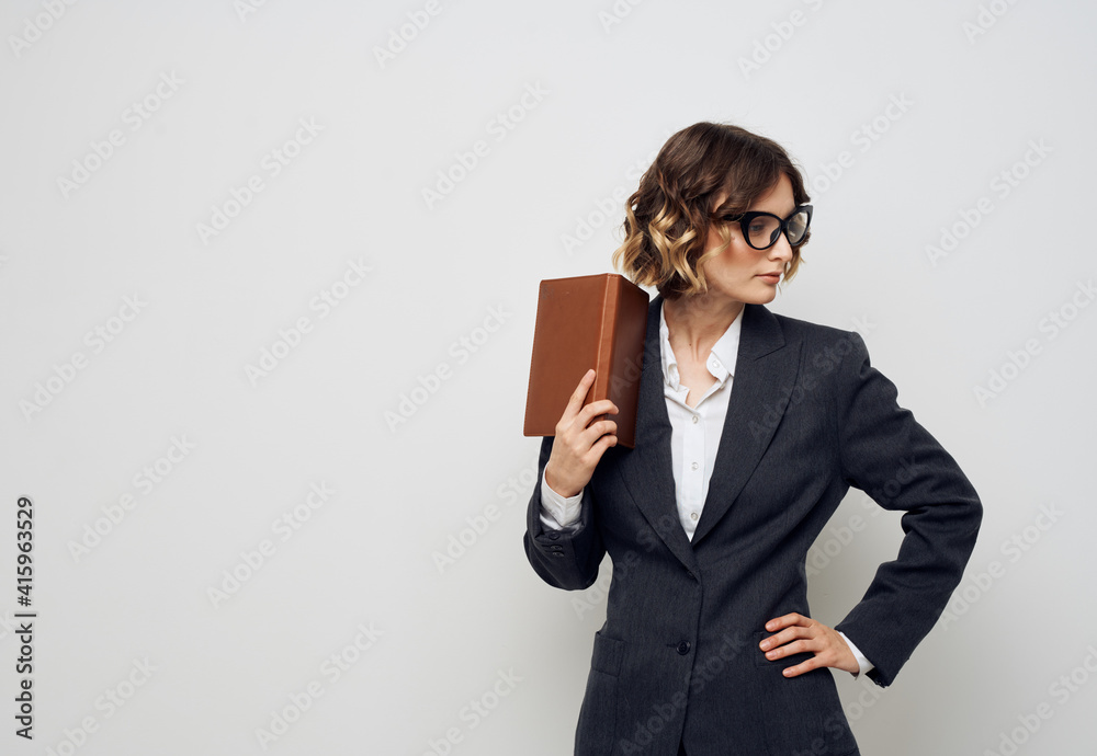 Woman with documents in hands classic suit and glasses hairstyle Woman with documents in hands classic suit and glasses hairstyle