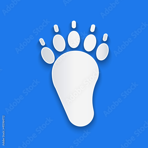 Paper cut Bear paw footprint icon isolated on blue background. Paper art style. Vector.