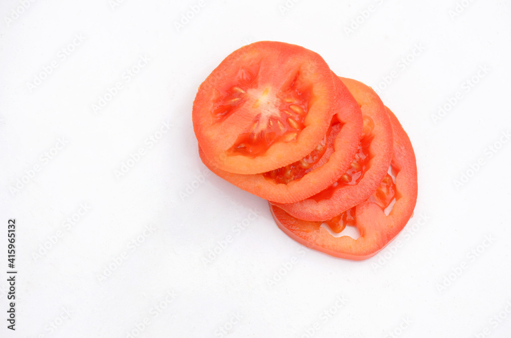 the red tomato sliced isolated on white background.