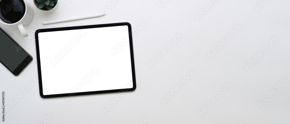Horizontal photo of mock up digital tablet, smartphone, coffee cup and copy space on white background. Horizontal photo of mock up digital tablet, smartphone, coffee cup and copy space on white background.