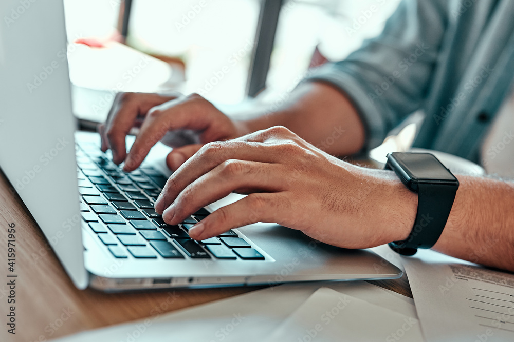 Closeup businessman hands typing on laptop keyboard in cafe. Closeup businessman hands typing on laptop keyboard in cafe.