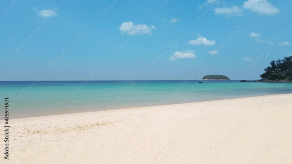 Phuket Thailand beach sea. Landscape view of beach sea and sand in summer sun. Beach space area background. At Patong beach, Phuket, Thailand. On 16 jan 2021. 4K UHD Video clip Phuket Thailand beach sea. Landscape view of beach sea and sand in summer sun. Beach space area background. At Patong beach, Phuket, Thailand. On 16 jan 2021. 4K UHD Video clip
