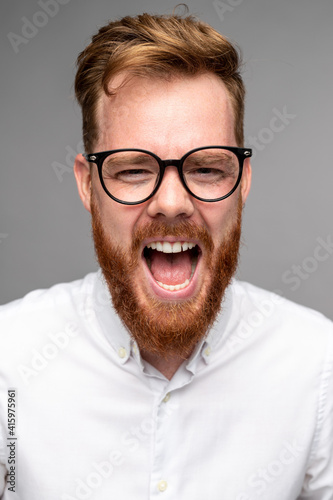 Angry bearded man screaming at camera © kegfire