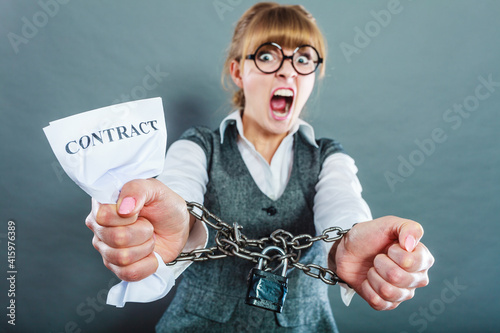 Furious woman with chained hands and contract