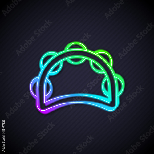 Glowing neon line Musical instrument percussion tambourine, with metal plates icon isolated on black background. Vector.