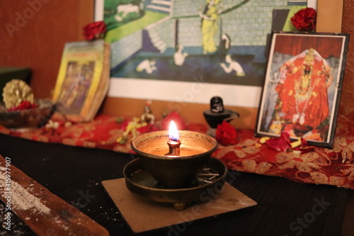 A small Hindu shrine and a lamp in the house