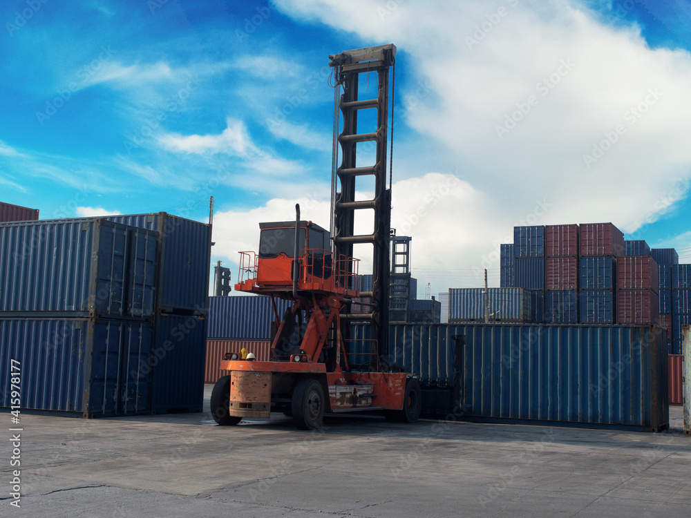 Terminal warehouse mortgage cargo container orange color forklift crane trade engineer technology transportation company factory logistic ecommerce international import export.Sky blue cloud white