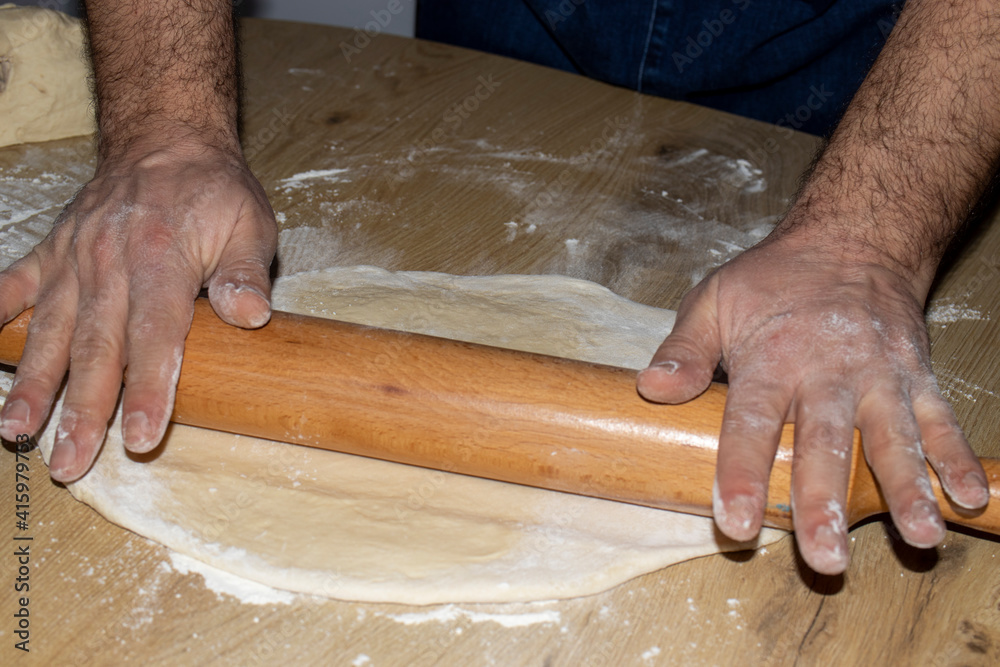 person kneading dough person kneading dough