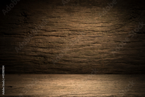 Selected focus empty brown wooden table and wall texture or old black brick wall blur background image. for your photomontage or product display