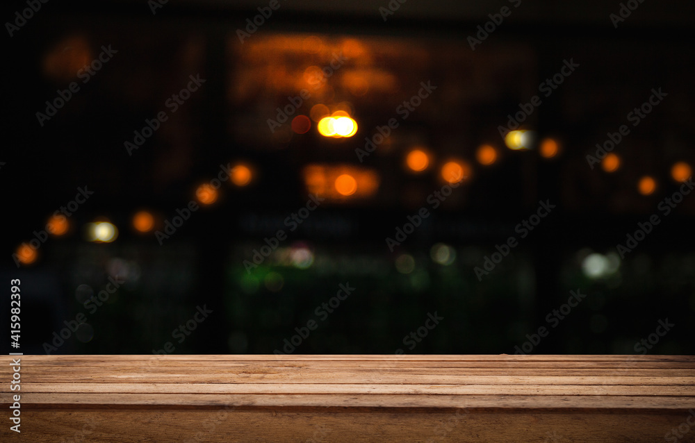 empty table to showcase your product, against the background of a blurred cafe golden bokeh