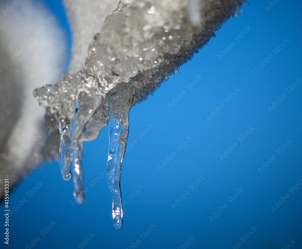 icicle hanging from the roof at the same winter icicle hanging from the roof at the same winter