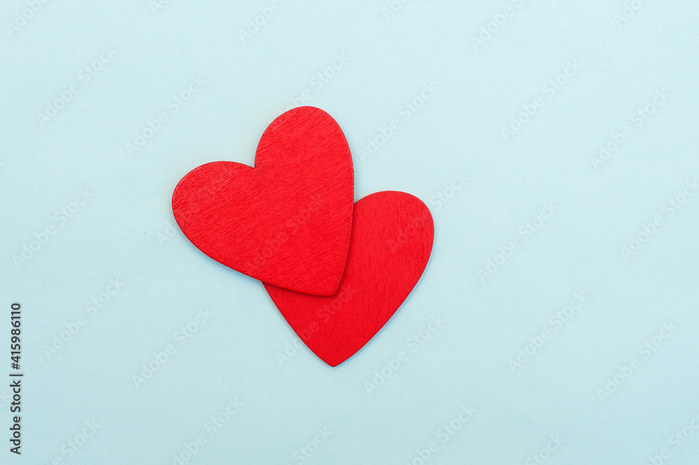 Two red hearts on a blue background