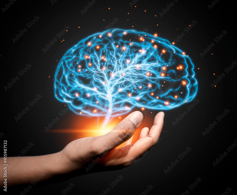 Hand holding glowing brain on dark background. AI network of brain on business analysis, innovative and business growth development Hand holding glowing brain on dark background. AI network of brain on business analysis, innovative and business growth development