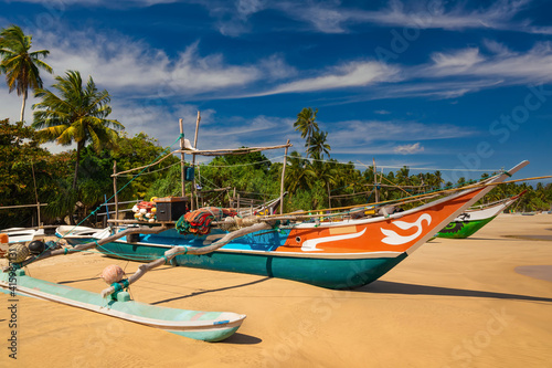 Traditional fishing boats on a sandy beach. Sri Lanka