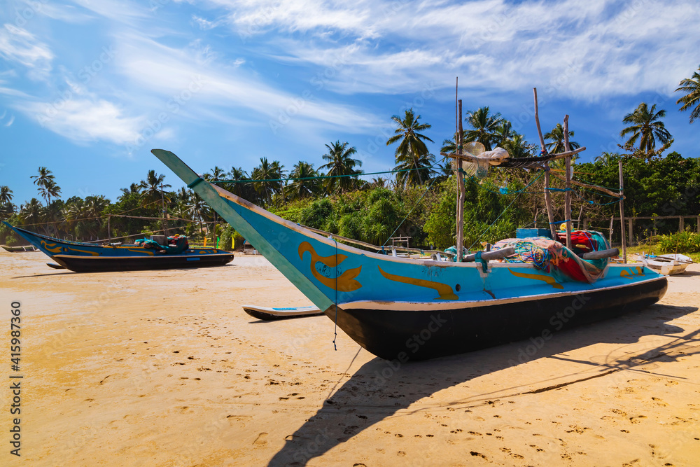 Traditional fishing boats on a sandy beach. Sri Lanka Traditional fishing boats on a sandy beach. Sri Lanka