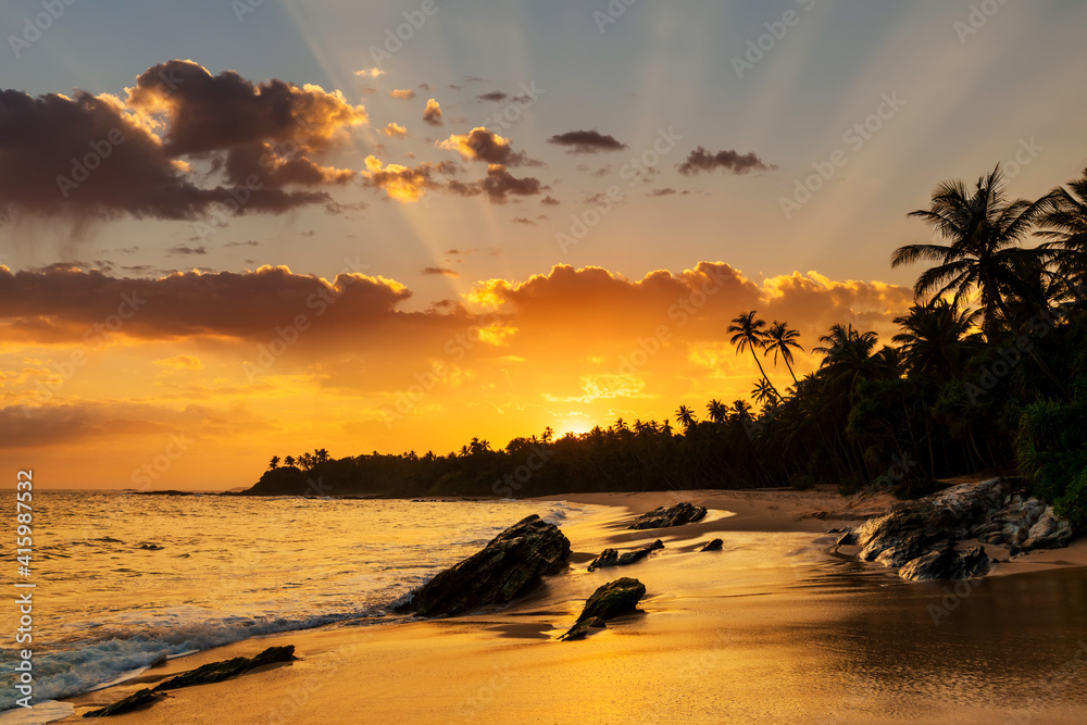 Beautiful sunset on the beach in a tropical resort in the Caribbean