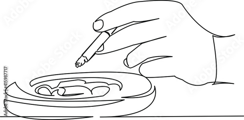 hand with ashtray and cigarette