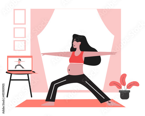 Pregnant woman taking online pregnancy yoga class.
