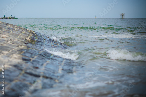 waves in the sea that hit the rocks on the beach. High quality photo