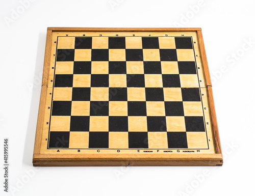 Chess board photographed on a white background.