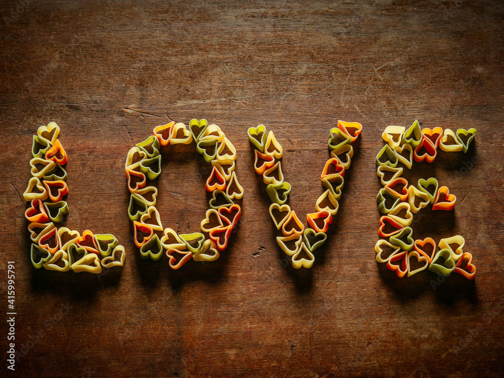 Heart-shaped pasta in the word love Heart-shaped pasta in the word love