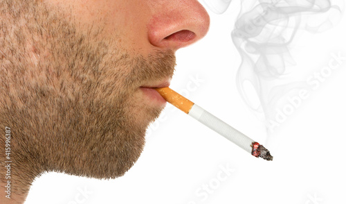 Side view of a man with a cigarette burning