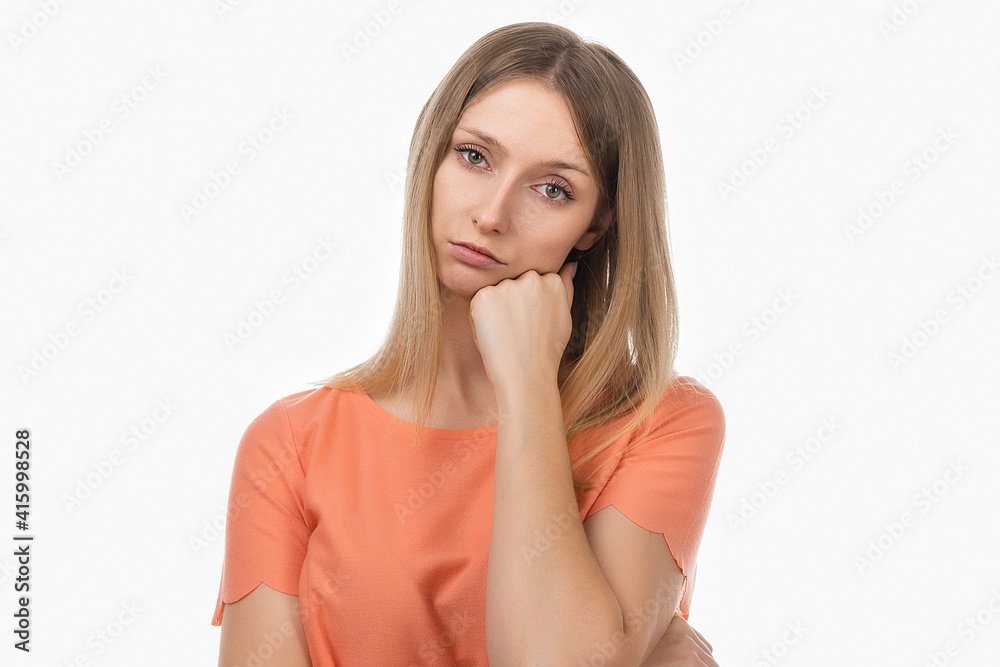 Bored young blond woman put head chin on hand having blank look. Girl suffering from idleness, lack of motivation Bored young blond woman put head chin on hand having blank look. Girl suffering from idleness, lack of motivation