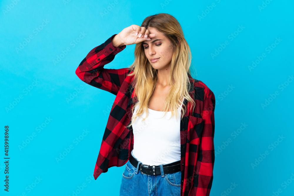 Young blonde Uruguayan woman over isolated background with tired and sick expression