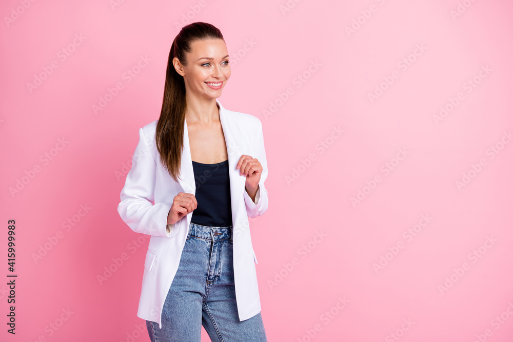 Photo of attractive young woman look stand empty space hold wear white jacket isolated on pink color background