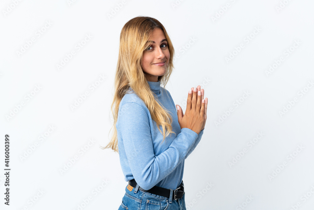 Young blonde Uruguayan woman over isolated background scheming something