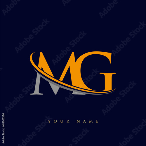 initial letter MG logotype company name yellow and grey swoosh design. isolated on dark background.