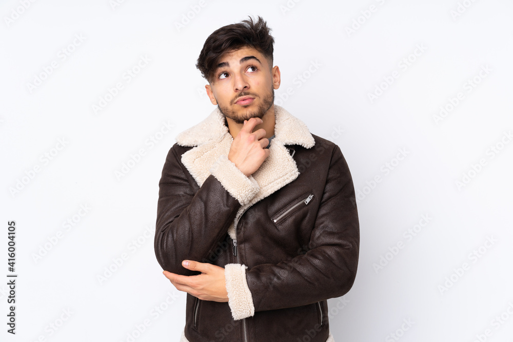 Arabian handsome man over isolated background having doubts Arabian handsome man over isolated background having doubts