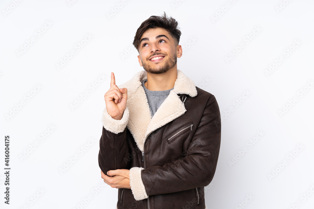 Arabian handsome man over isolated background pointing up a great idea Arabian handsome man over isolated background pointing up a great idea