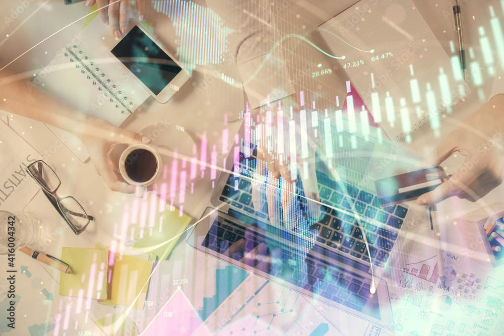 Multi exposure of man's hands typing over computer keyboard and forex graph hologram drawing. Top view. Financial markets concept. Multi exposure of man's hands typing over computer keyboard and forex graph hologram drawing. Top view. Financial markets concept.