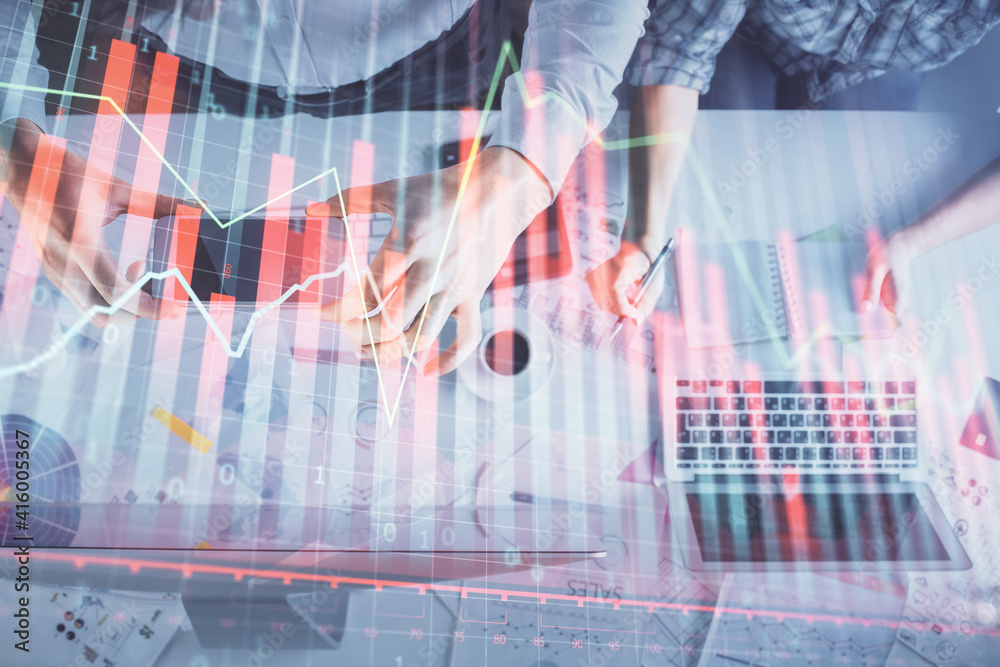 Double exposure of man and woman working together and financial chart hologram drawing. market analysis concept. Computer background. Top View. Double exposure of man and woman working together and financial chart hologram drawing. market analysis concept. Computer background. Top View.