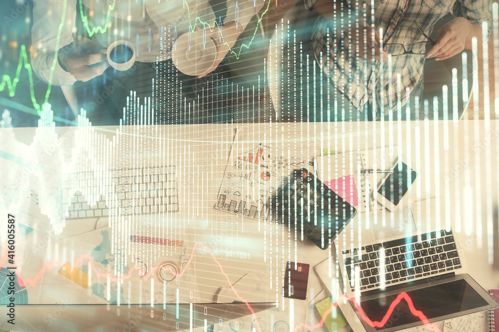 Double exposure of man and woman working together and financial chart hologram drawing. market analysis concept. Computer background. Top View. Double exposure of man and woman working together and financial chart hologram drawing. market analysis concept. Computer background. Top View.
