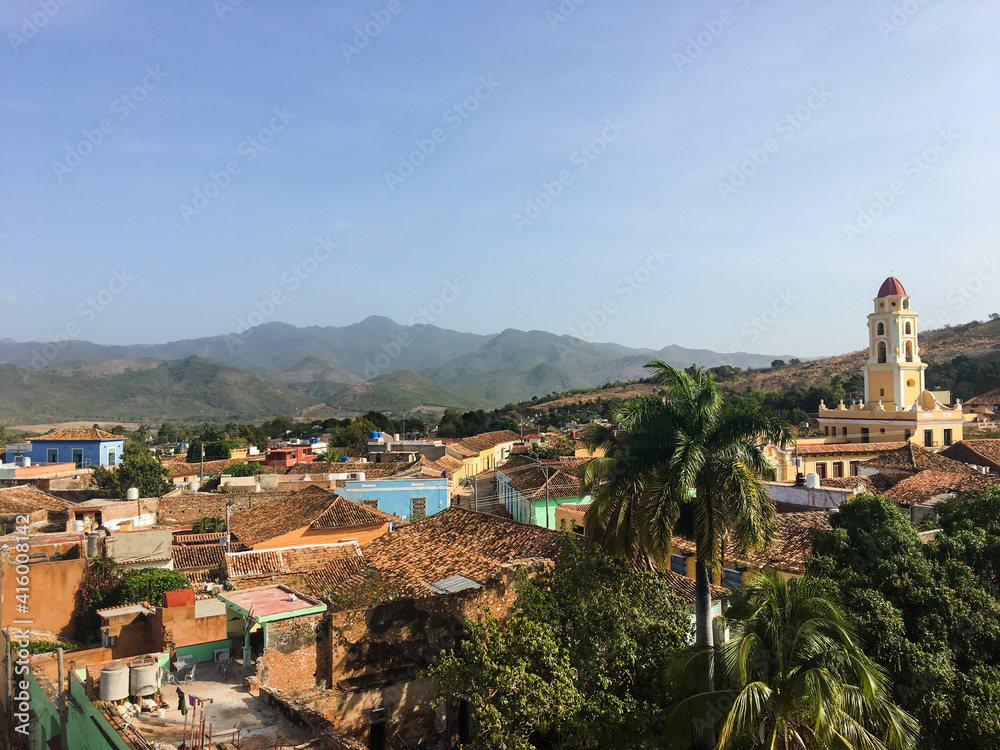 Iconic view of the Cuban city of Trinidad, in the province of Sancti Spiritus, with the Escambray Mountains in the background on a clear day. Panorama of colonial city in Cuba.