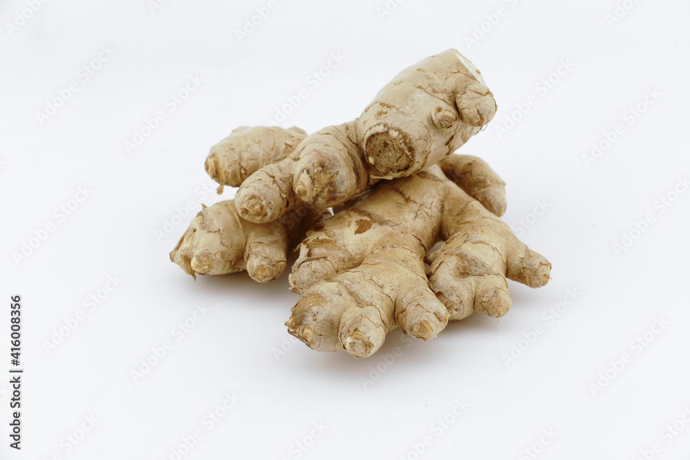 Fresh ginger on a white isolated background - close-up photo