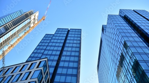 View of a skyscraper under construction. Modern architecture background. Building a high-rise building   the concept of real estate construction. 