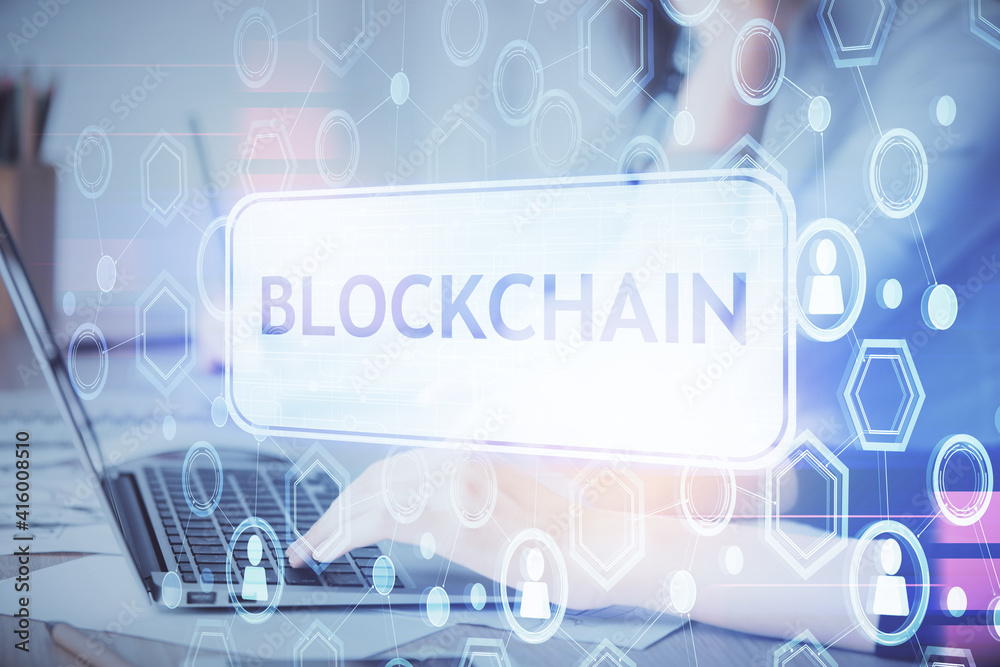 Double exposure of woman hands typing on computer and crypto market theme hologram drawing. Blockchain concept. Double exposure of woman hands typing on computer and crypto market theme hologram drawing. Blockchain concept.