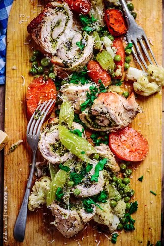 Turkey roll with pesto baked with vegetables .style rustic.